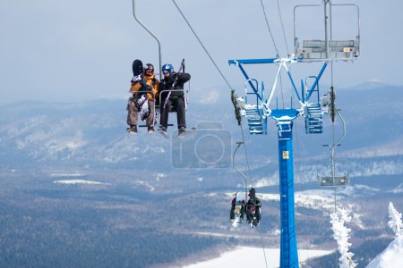 Skiers on a ski lift