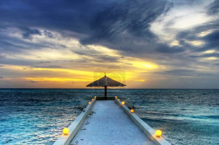 Maldivian umbrella sunset