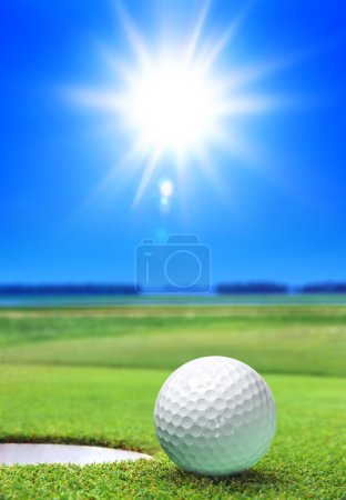 Golf ball on green course