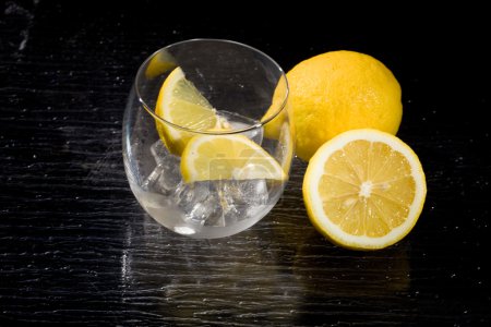 photo of lemon on ice cubes