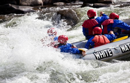 Group in out of control white water raft