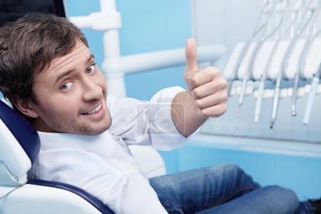 A young man in a dental chair