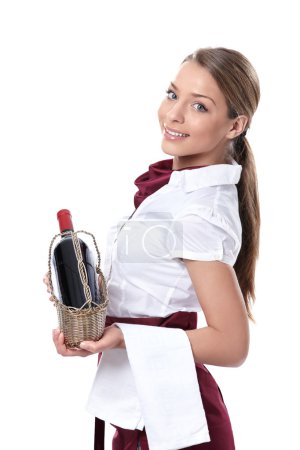 A waitress with a bottle of wine