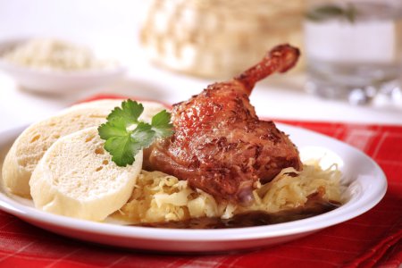 Roast duck with sauerkraut and dumplings