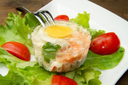 Aspic with shrimps and egg