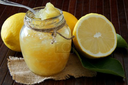 Lemon homemade jam on wooden background