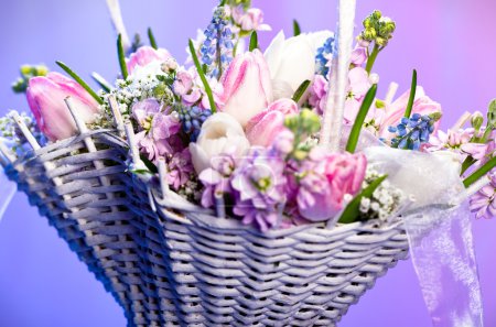 Beautiful spring flowers in a basket