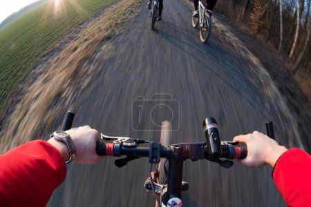 Riding a mountain bicycle on a country road (motion blurred image)