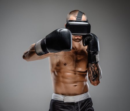 Boxing fighter in virtual reality glasses