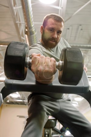 Man Doing One Arm Dumbbell Curl