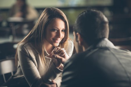 Romantic couple flirting at the bar