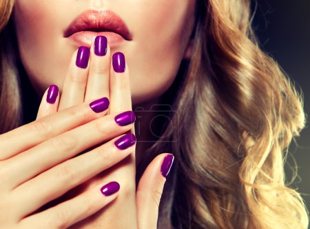 Model with violet manicure