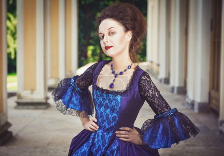 Beautiful woman in blue medieval dress 