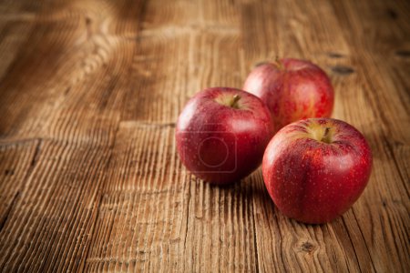 Fresh harvested apples on wood