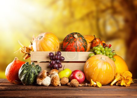 Autumn fruit and vegetable in wooden box