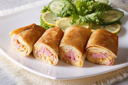 Crepes with ham and cheese close up horizontal
