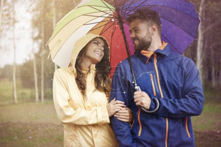 Loving couple with umbrella