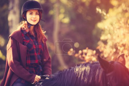 Young woman and horse