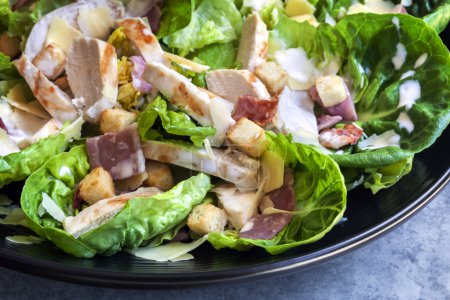 Chicken Caesar Salad in Black Bowl