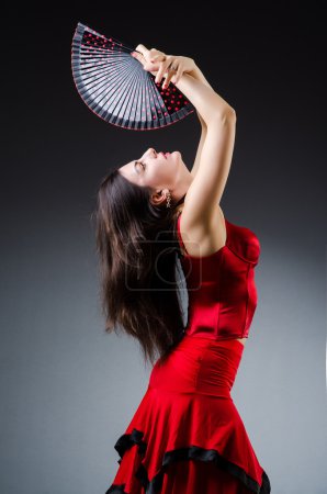 Woman with fan dancing dances