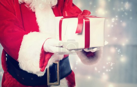 Santa Claus Giving a Christmas Present
