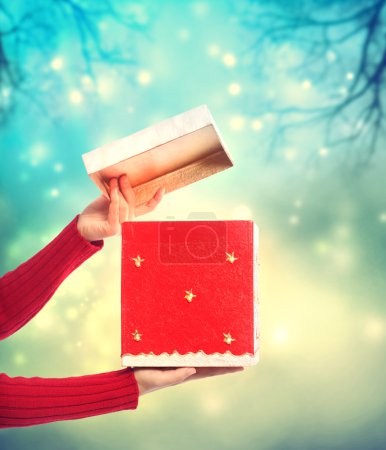 Woman holding red gift box