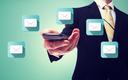 Businessman with email and cell phone