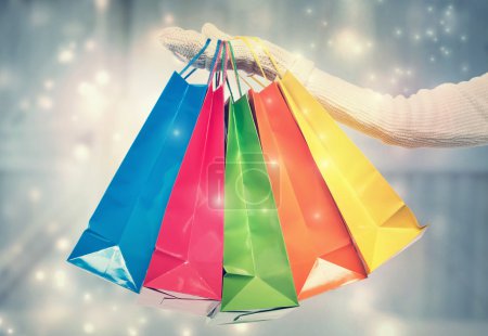 Woman holding colorful shopping bags