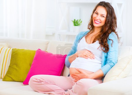 Pregnant woman  caressing  belly