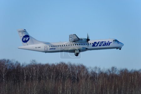 Nizhny Novgorod. Russia. February 17, 2015. The passenger ATR-72 plane of the company Utair-Express flies up in the sky