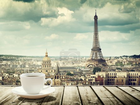 background with cup of coffee and Eiffel tower in Paris
