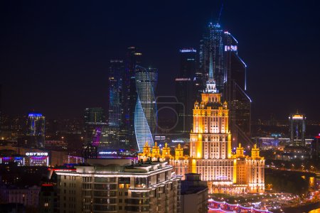 Moscow Business City and Stalin skyscraper building night aerial panorama