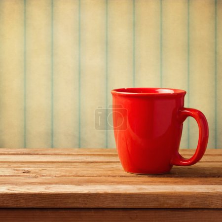 Vintage background with red coffee mug
