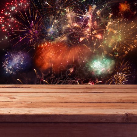 Table over fireworks background