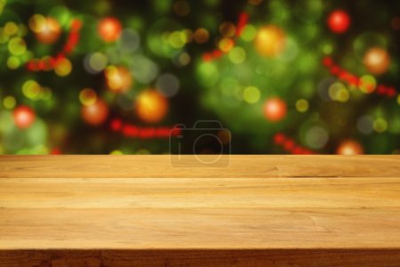 Table over Christmas tree bokeh background