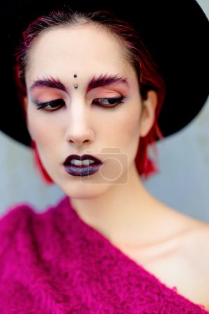 Attractive young woman with colorful makeup