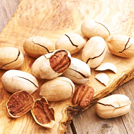 Pecan nuts on wooden table