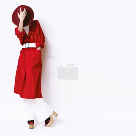 Beautiful vintage lady fashionable style in a red cloak and hat