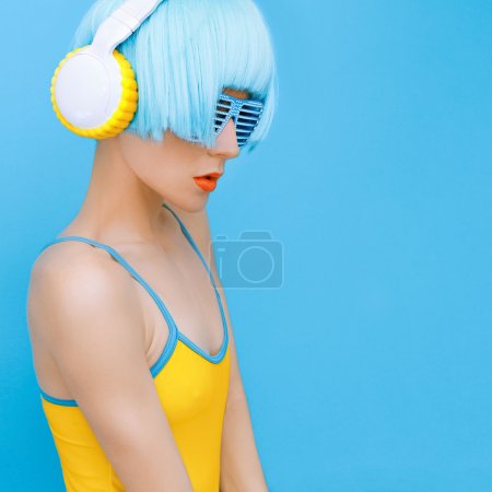 sensual DJ-lady in style headphones listening to music