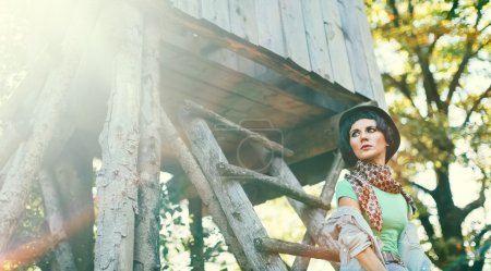 Fashion portrait model in the autumn forest. Country Style Acces