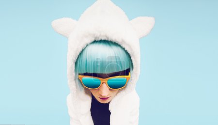 Fashion Girl in hoodie Teddy Bear on a blue background