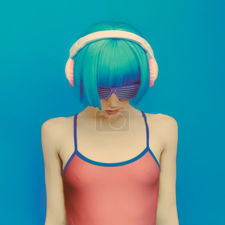unreal DJ girl in fashionable headphones listening to music