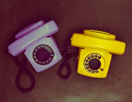 two vintage phone on a dark background