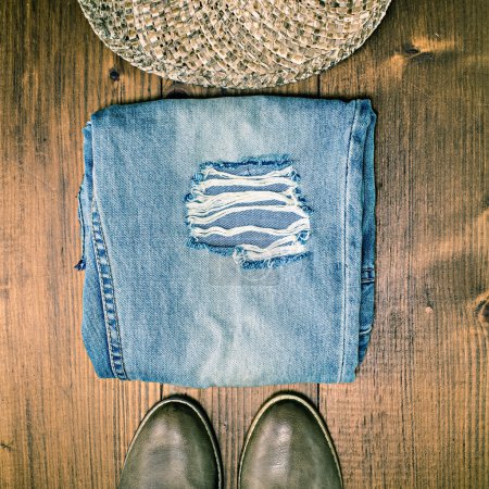 Shoes Jeans and Hat on Wooden Floor