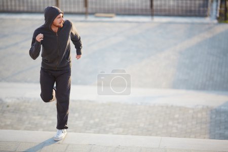 Man in activewear jogging