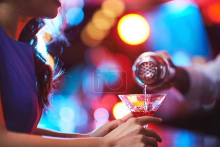 Girl holding martini glass