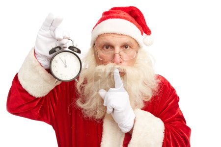 Santa Claus with alarm clock