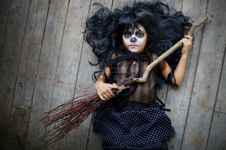 Halloween girl with broom