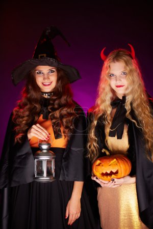 Women with lantern and pumpkin