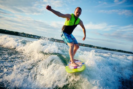 Young man surfboarding